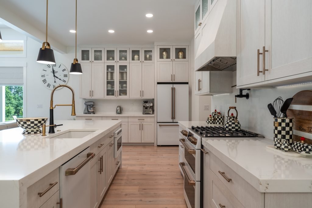 beautiful newly built kitchen with white cabinet and a quartz countertop built by kamanski construction