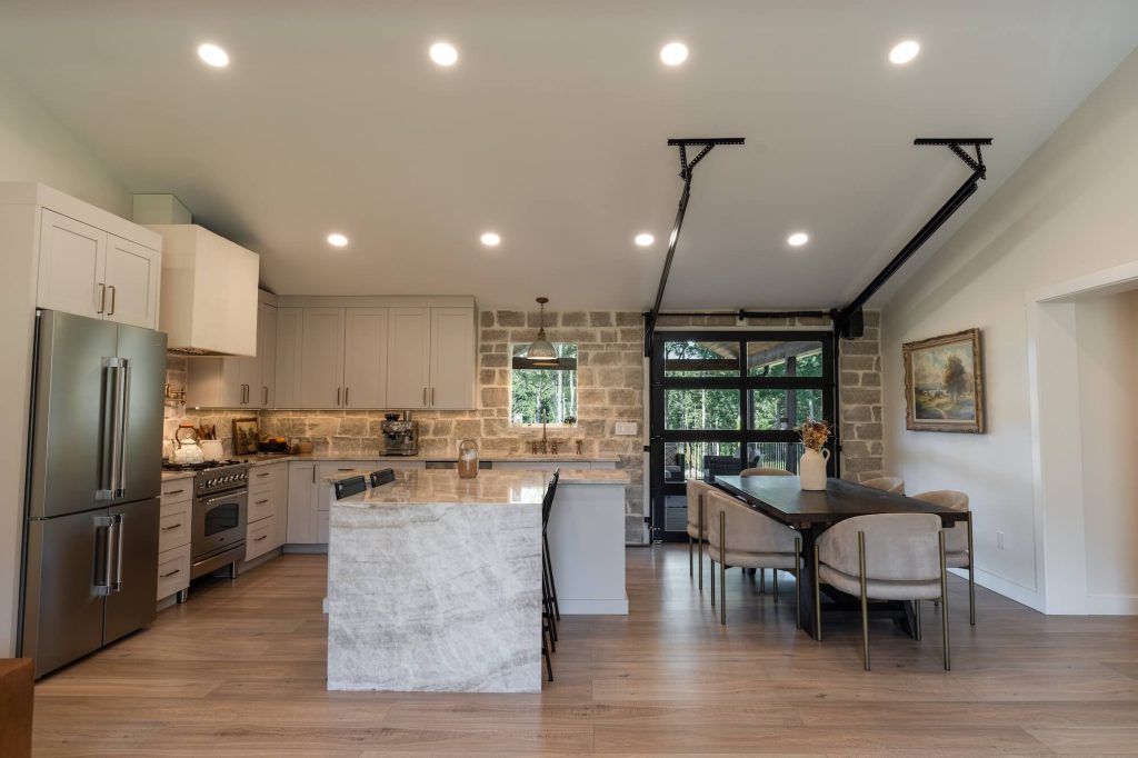 modern kitchen with unique garage style door to the backyard