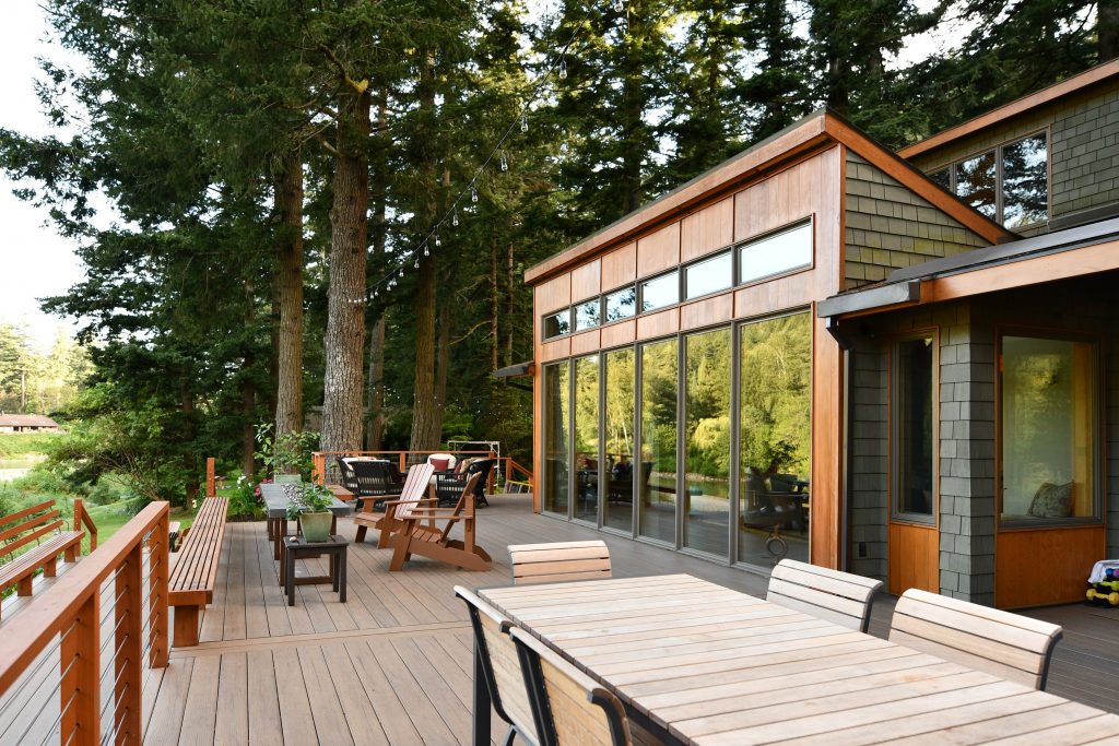 newly remodeled deck in south carolina with a forest and river in the backyard